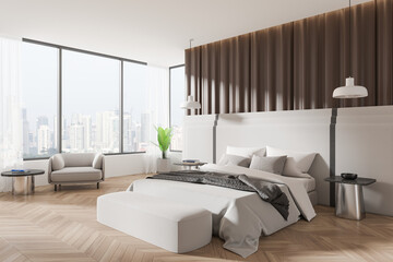 Modern hotel bedroom interior with bed, bench and armchair, panoramic window