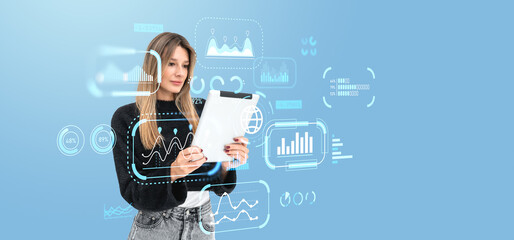 Woman analyzing data on tablet surrounded by futuristic digital