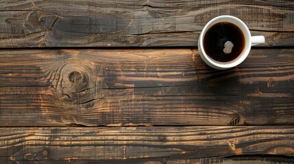 Top view of coffee cup on wooden table with empty space