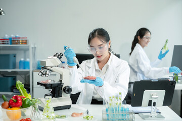 Team Microbiologists Analyzing Molecular Samples in Advanced Food Science Laboratory, Dietitian food and medicine.