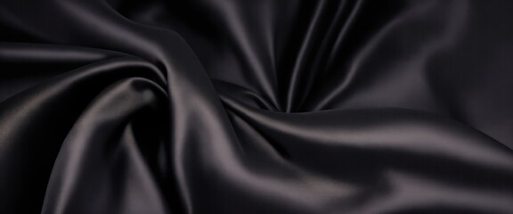 Fototapeta premium Luxurious Black Silk Fabric with Elegant Rich Folds