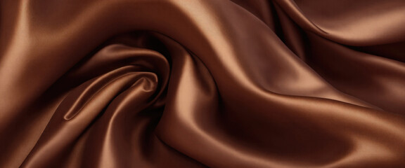 Fototapeta premium Luxurious Brown Silk Fabric with Elegant Rich Folds