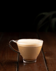 cup of cappuccino on wooden table