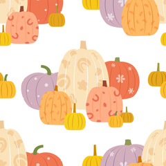 Bright pumpkins with patterns isolated on a white background. Seamless vector pattern.