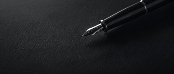 A sleek black fountain pen set against a dark background, exuding elegance and sophistication in simplicity.