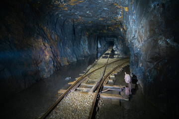 Railway switch in flooded abandoned graphite mine