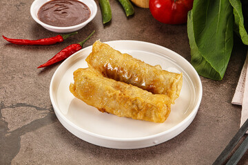 Vietnamese stuffed spring roll served sauce