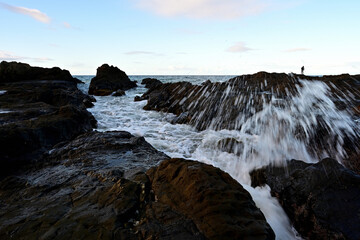 sea waves hitting rocks