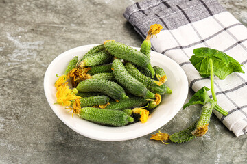 Raw gherkin cucumbers in the bowl