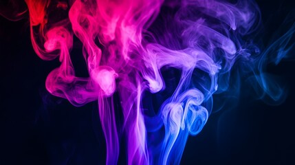 Obraz premium Abstract colorful smoke against a dark background.