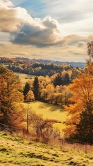 Fototapeta premium Golden autumn colors paint the hillsides in a beautiful scene.