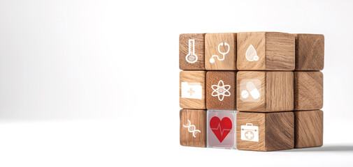 Obraz premium Conceptual image of wooden cube with health symbols, representing wellness and care