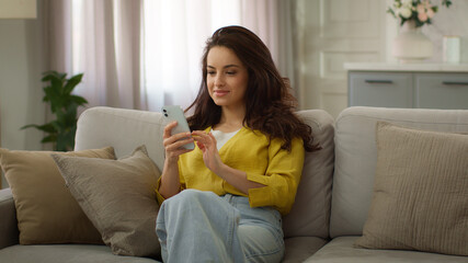 Happy family spending weekend together. Caucasian woman female mother using mobile cell phone...