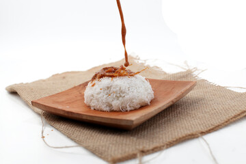 Ketan Kelapa Parut, Indonesian traditional snack, made from steamed glutinous rice and served with grated coconut and peanut sauce