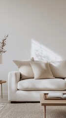 Cozy living room with neutral-toned sofa and natural light during the afternoon