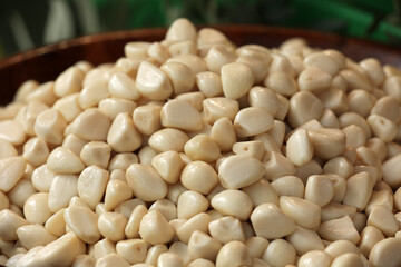 Garlic cloves in a bowl at a market