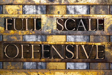 Full Scale Offensive text in real authentic typeset letters on vintage textured silver grunge copper and gold background