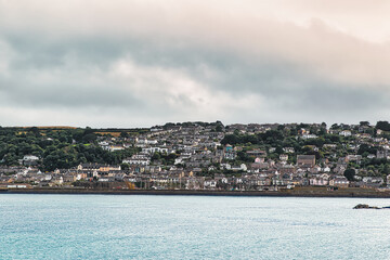 Fototapeta premium Coastal Town Overlooking Calm Sea in Penzance, Cornwall, UK