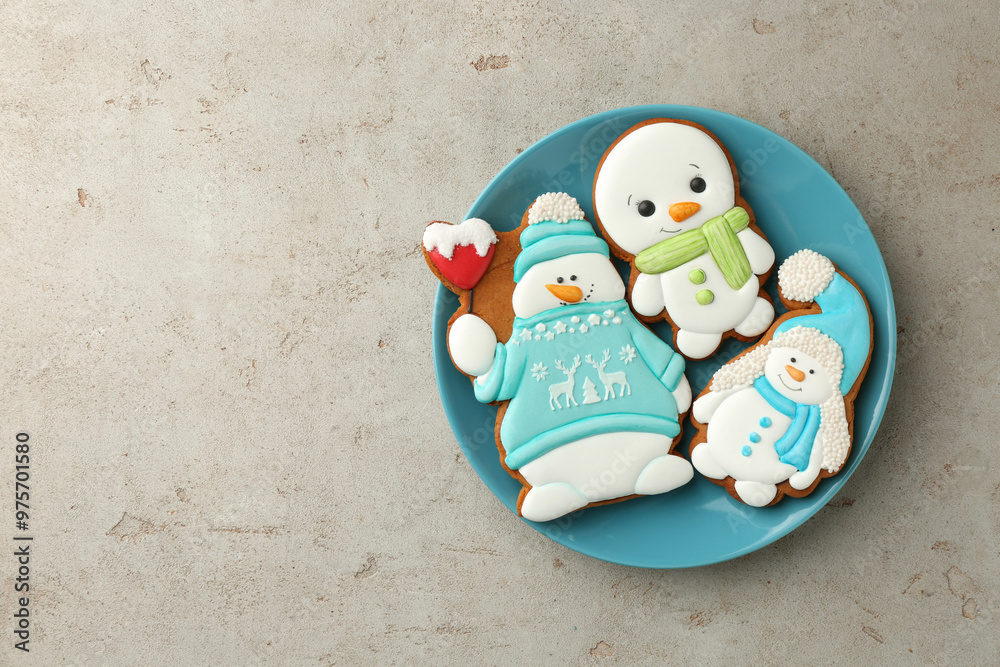 Sticker Delicious cookies in shape of snowmen on light grey table, top view. Space for text