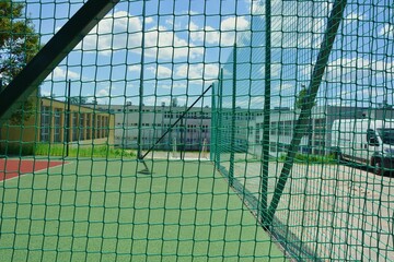 Rope mesh fence on a sports field.