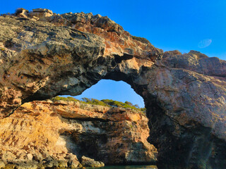 curious rock formation on the coast of mallorca called es pontas