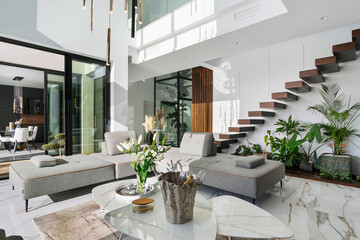 Luxurious modern living room interior with lush greenery