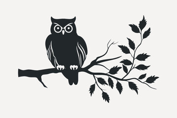 Owl silhouette on branch