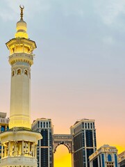 The minaret of the Grand Mosque with the golden crescent. The crescent is covered with gold-plated...