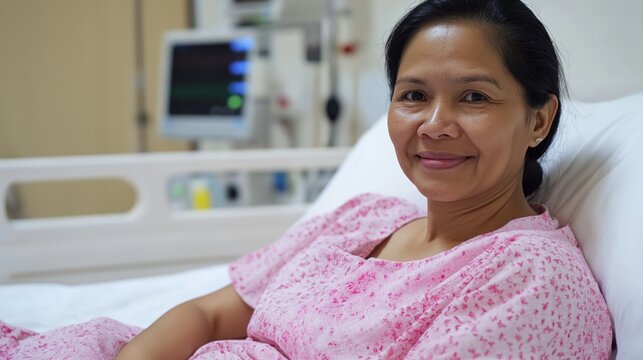 Filippina Woman in her 40s in Hospital Bed for Medical Recovery and Treatment Concept