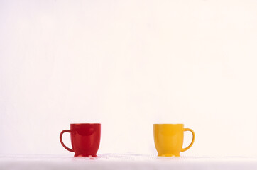 Red and yellow cup on a light background.