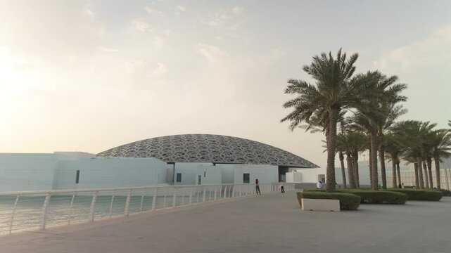 Abu Dhabi, United Arab Emirates - September 15, 2024: Louvre museum in Abu Dhabi exterior and entrance with characteristic architecture
