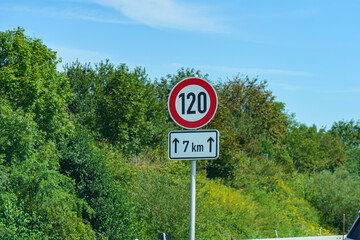 Sign 120 on the motorway. Speed limit road sign.