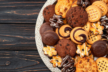 Mix of cookies . Many unhealthy snacks . Top view