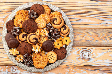 Mix of cookies . Many unhealthy snacks . Top view