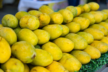 Mangoes at a market stall Sweet fruit, ripe, exotic and tasty.
