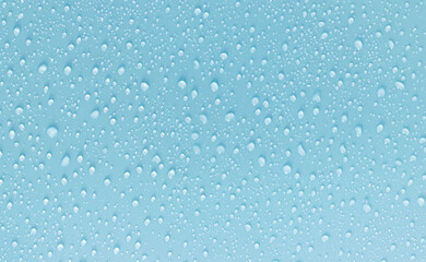 Close-up of Water Droplets on a Smooth Blue Surface