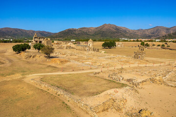 Ruins of the monastery, the town, and the ancient medieval walls of Roses, Spain, inside the citadel