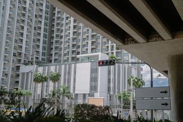 Traffic signs under overpasses in cities with high-rise buildings