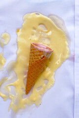 Iice cream with waffle cone on a white shirt, dirty stain