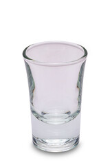 Closeup vertical view of single empty transparent shot drink whisky glass isolated on white background with clipping path
