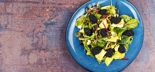 Plate of colorful fresh salad, recipe place.