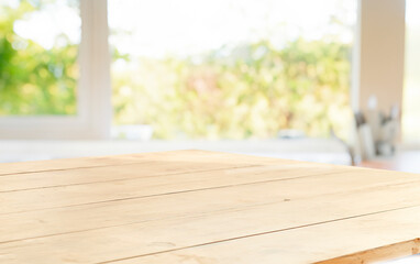 wooden table close up, against wall with warm sunset light from window, table for advertising display your products.