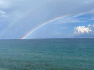 Double rainbow over the ocean horizon
