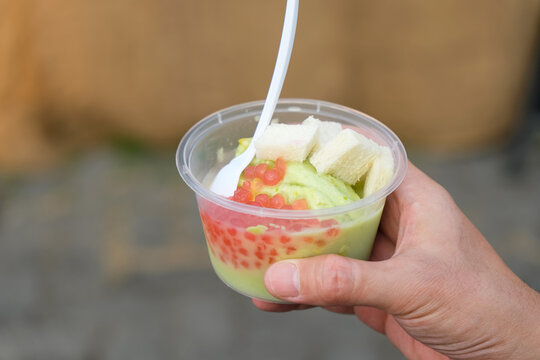 Es Puter Alpukat or Es Podeng, traditional Indonesian coconut ice cream sundae topped with bread ,jelly, and avocado
