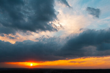 Colourful landscape of beautiful sunset or sunrise with cloudy sky. Natural abstract background.