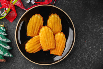 Madeleine, sweet biscuit dessert Christmas cookie delicious Christmas treat Fresh delicious gourmet food background on the table rustic food top view copy space