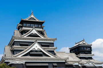 Kumamoto castle, black castle with blue sky and white cloud background