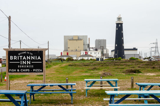 Dungeness, Kent, UK - 6th April 2024: Renownded restaurant "Britannia Inn"  welcomes visitors under the backdrop of Dungeness B nuclear power station.