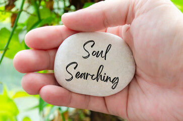 Soul Searching text engraved on white stone. Motivational and inspirational concept