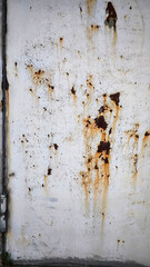 Rust on the iron door for the background. old peeling paint on rusty gates.
